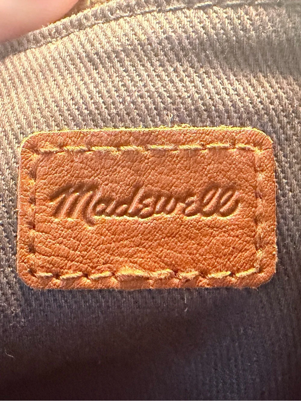 Madewell The Zip-Top Transport Crossbody Bag in English Saddle Leather.